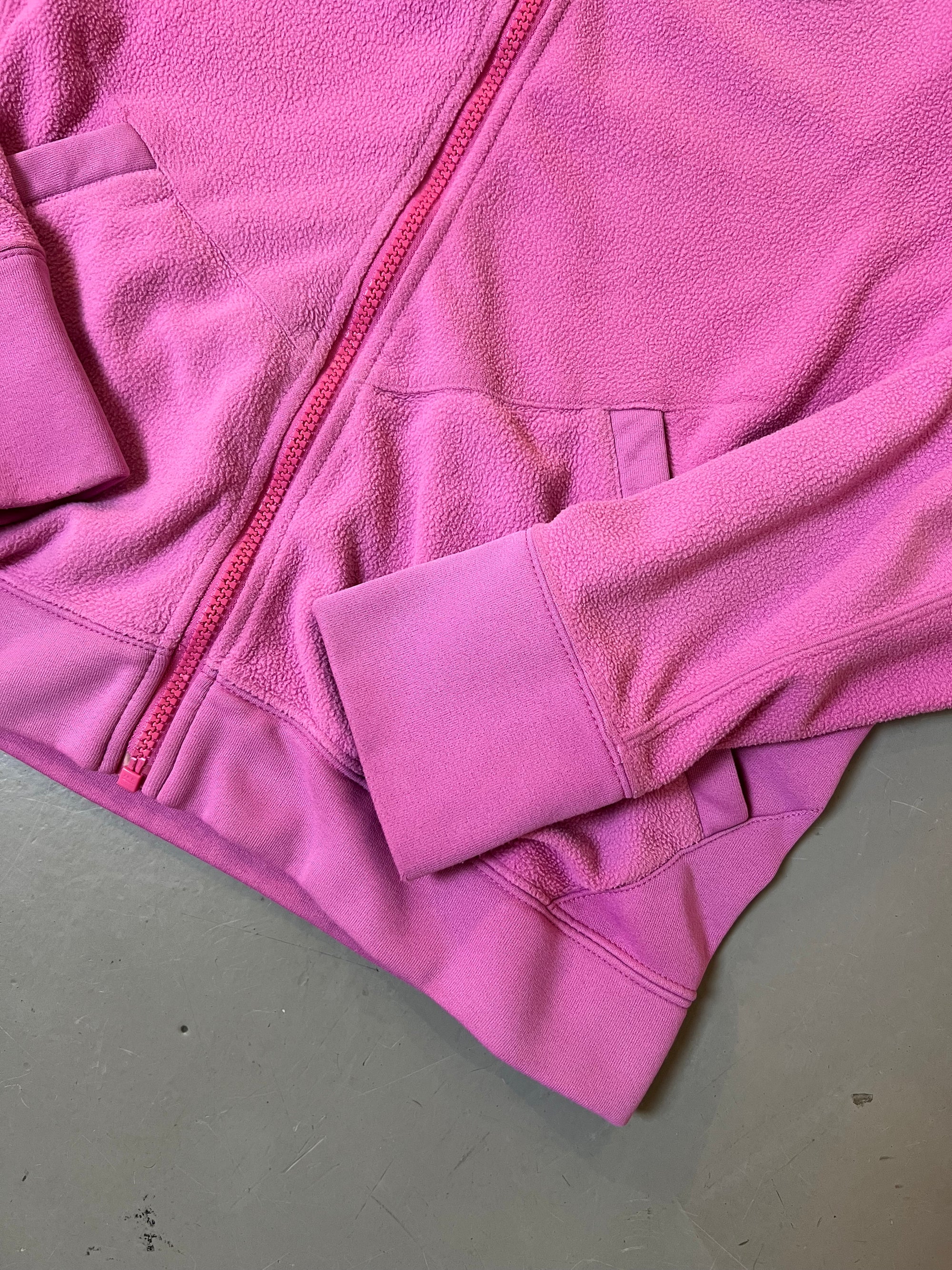 Zu sehen ist eine Pinke Fleece Jacke von Nike ACG